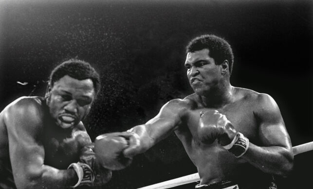 In this Oct. 1, 1975 file photo, Heavyweight champion Muhammad Ali connects with a right against challenger Joe Frazier in the ninth round of their title fight in Manila, Philippines. Ali won the fight on a decision to retain the title. Ali, the magnificent heavyweight champion whose fast fists and irrepressible personality transcended sports and captivated the world, has died according to a statement released by his family Friday, June 3, 2016. He was 74. (AP Photo/Mitsunori Chigita)